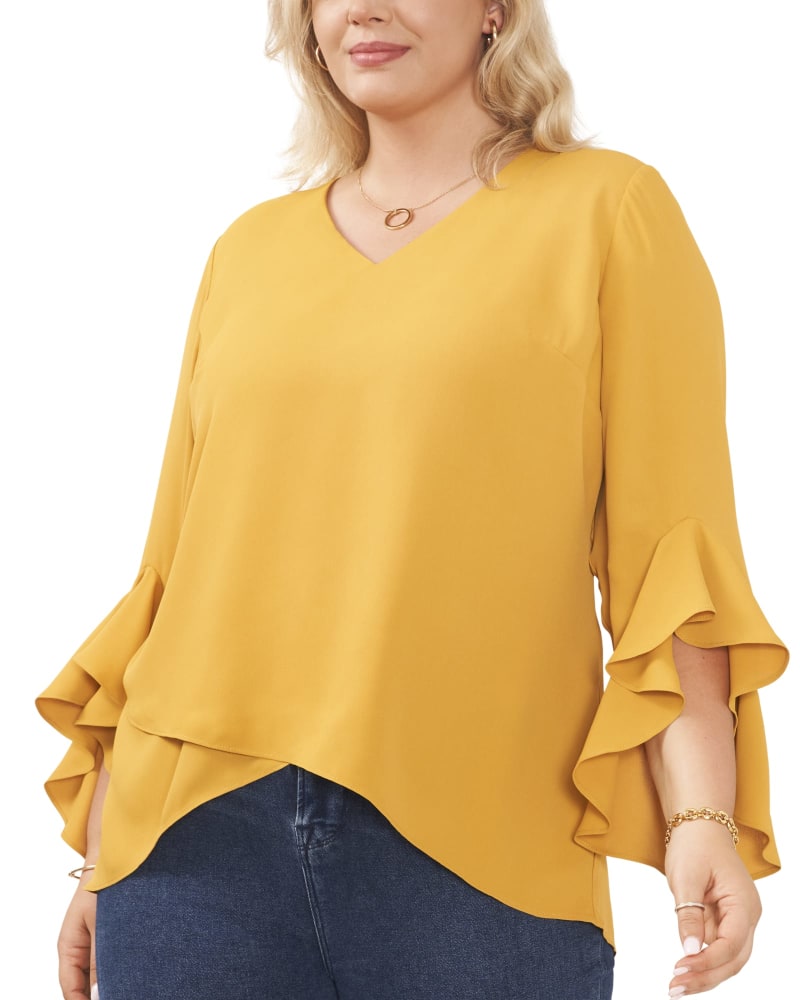 Front of a model wearing a size 1X Natalie Flutter Sleeve Tunic in HONEY POT by Vince Camuto. | dia_product_style_image_id:261285